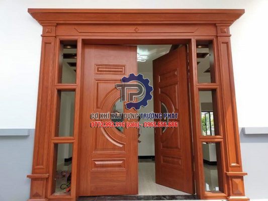 Cửa nhôm nguyên tấm vân gỗ giá rẻ thi công lắp đặt tại Quận 10